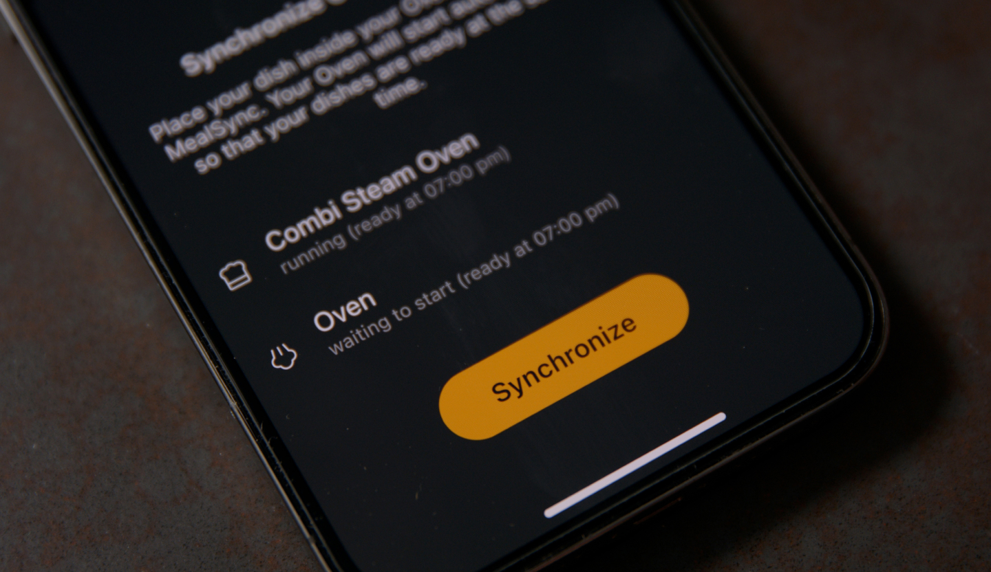 Smartphone-App zur Synchronisierung der Garzeiten von Backofen und Dampfbackofen.